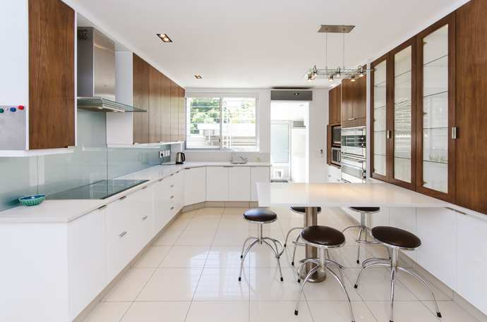 The light-filled kitchen boasts modern finishes and clean lines.