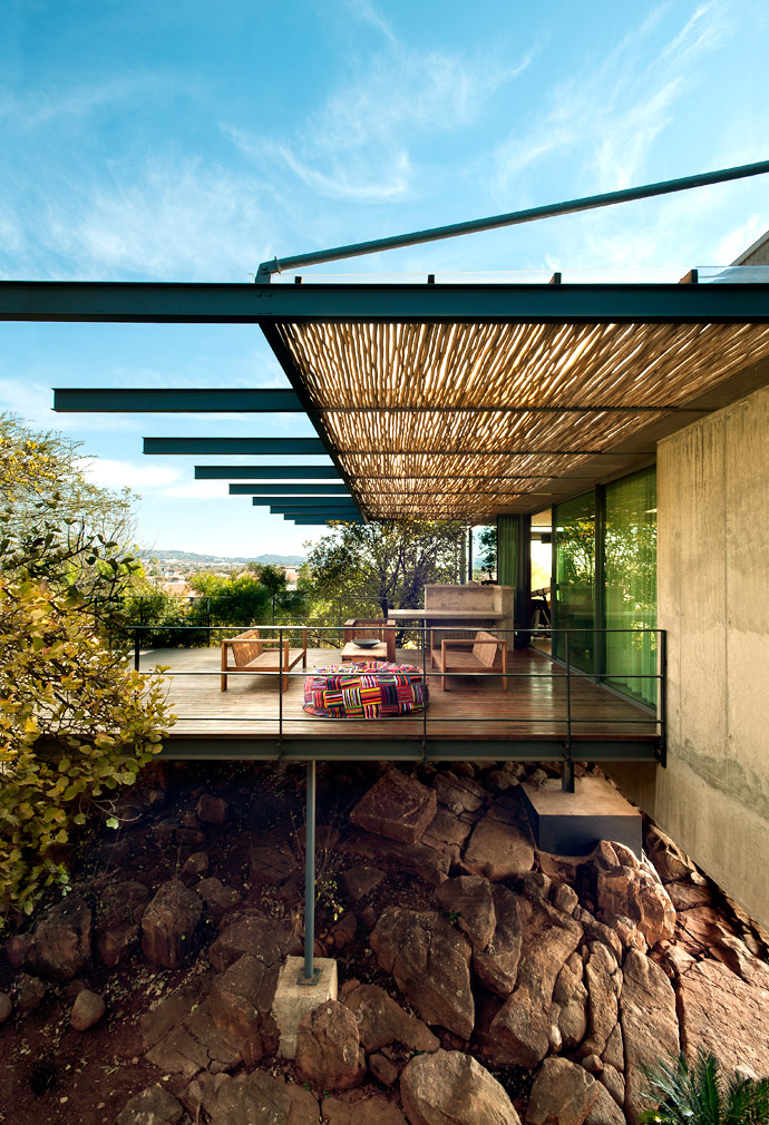 Tucked in-between the trees, the timber deck seems to be the perfect spot for bird watching by day and star gazing by night while lazing away the hours in the plush Bori Bori bean bag from Ashanti Contemporary African Designs.