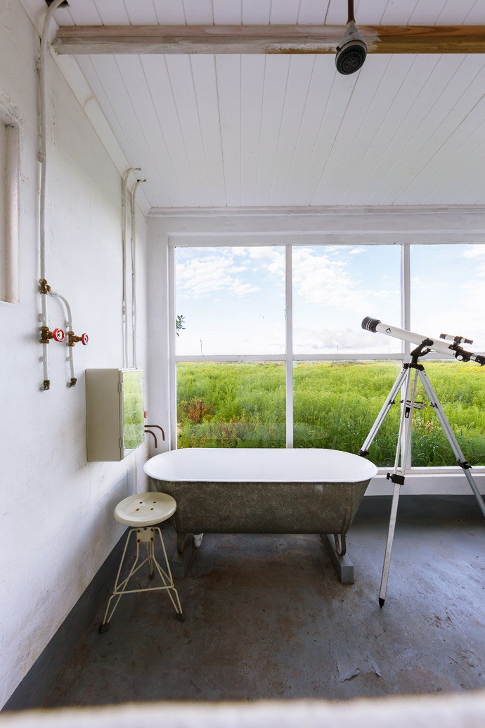 Kobus bought the enamelled tin bath at the eclectic Koöperasie Stories store in Simondium, near Paarl, and the K-Way lunar telescope is from Cape Union Mart.