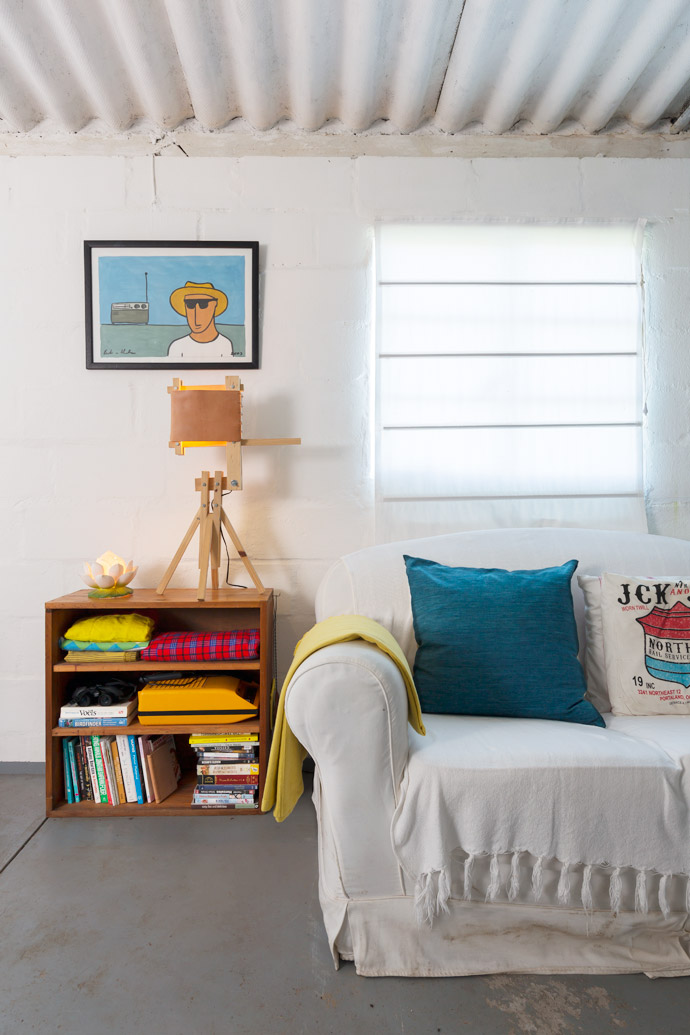 An oil-on-paper painting by artist Roelie van Heerden hangs above Jan Douglas’s delightfully whimsical Kantelknaap table lamp.