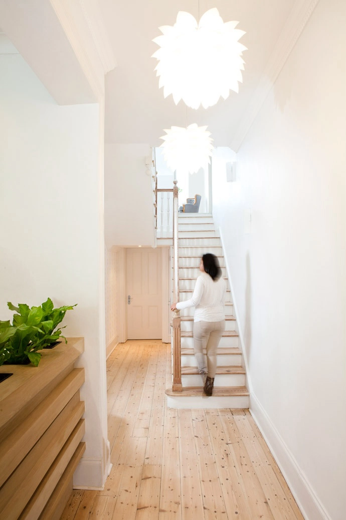 The staircase to the upper level, as seen from the entrance.