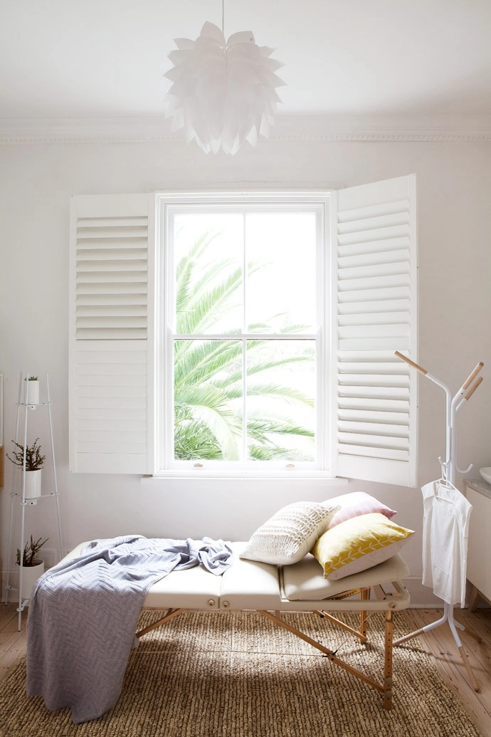 The treatment bed is from Zendu, the grey wool throw from Country Road, and the scatter cushions from Skinny laMinx and Country Road. The vertical plant stand and Mesopotamia Multi stand are from Stable.