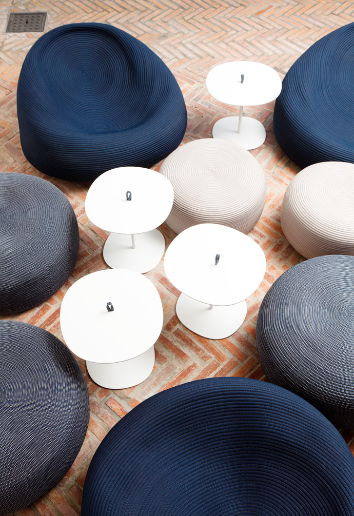 The blue-and-white casual outdoor furniture is by Paulo Lenti from Italy.   
