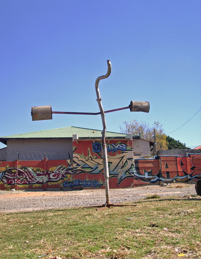 DIY signage for informal exhaust pipe repairs.