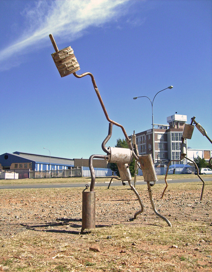 DIY signage for informal exhaust pipe repairs.