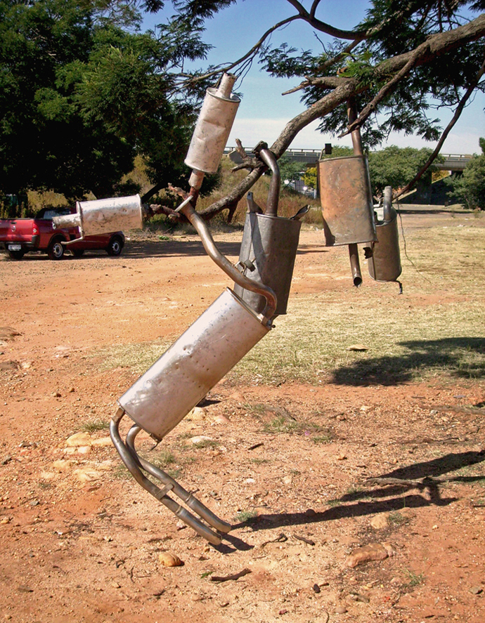 DIY signage for informal exhaust pipe repairs.