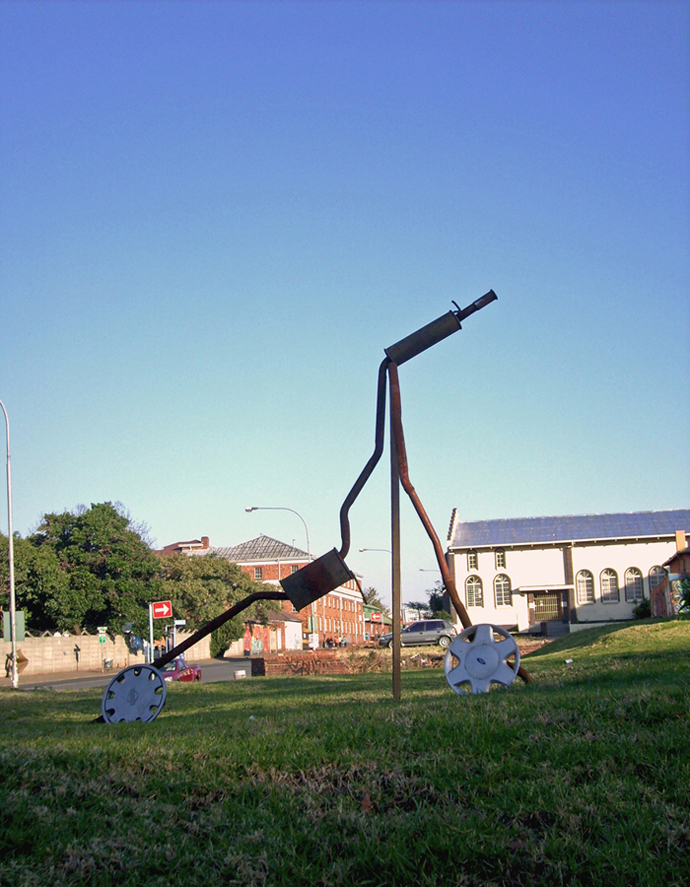 DIY signage for informal exhaust pipe repairs.