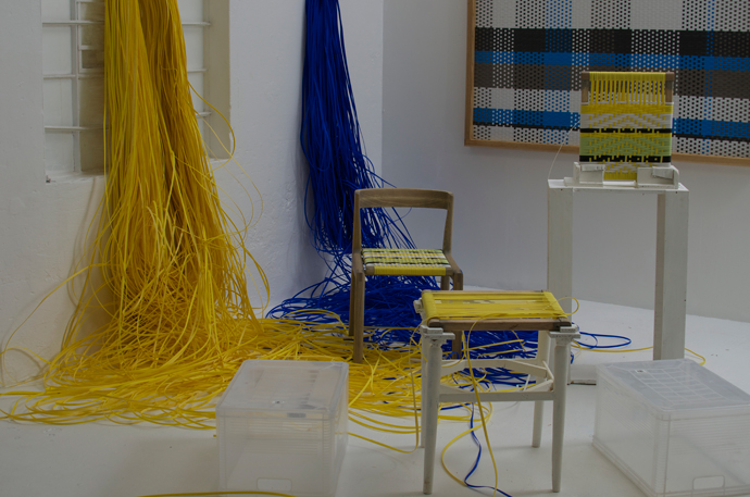 Woven panel and chair by John Vogel. The weavers, below from left, are Lizelle Andrews, Tishina Watson and Charnielle Davids. Image credit: Tracy Lynch.