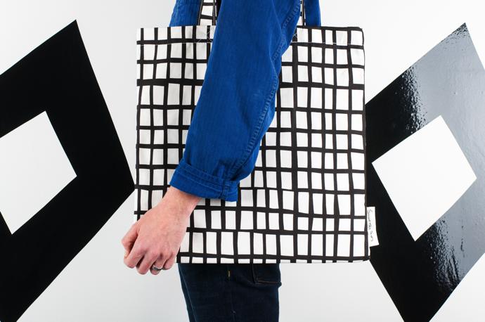 holding-black-square-bag-landscape