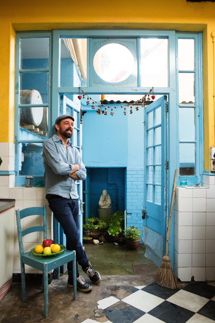 Harem stands by the kitchen door to the courtyard, which was inspired by the Blue City of Jodhpur in India.