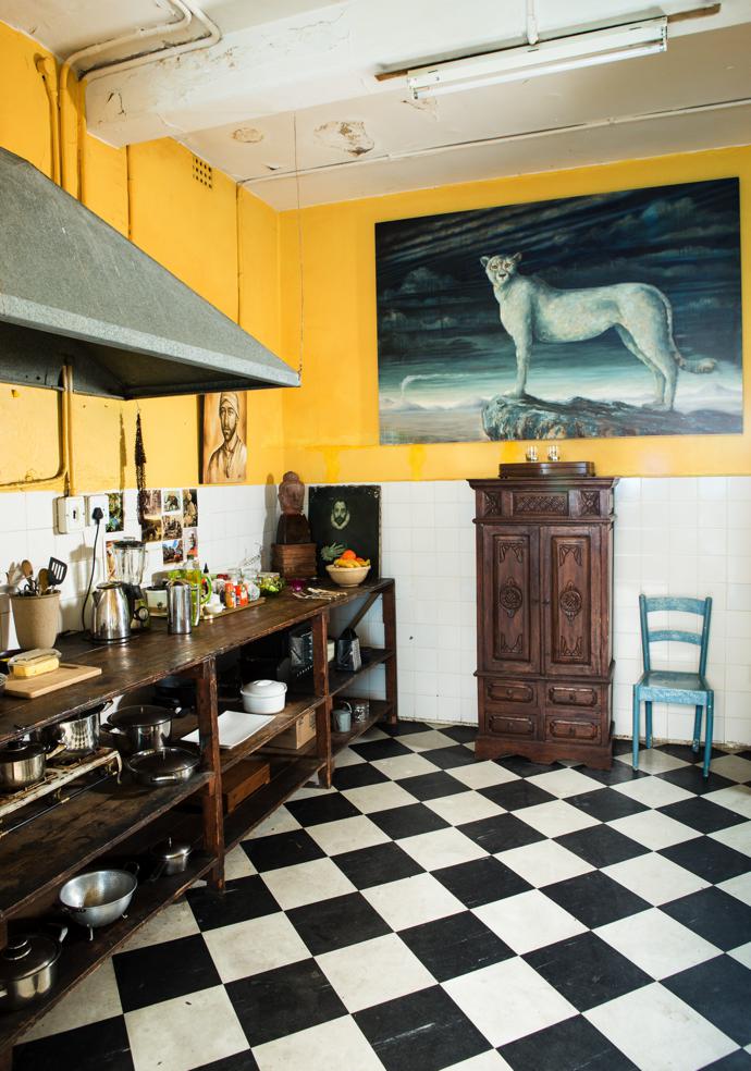 The kitchen was yellow already, which worked with Harem’s desire for an Indian feel. The cheetah painting is a work in progress.