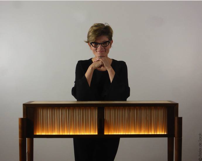 Sarah with her award-winning piece Aurore, which took her 224 hours to make.