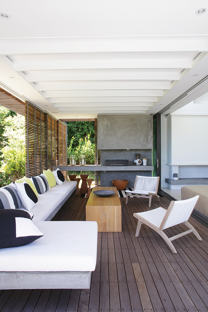 The fabrics for the outdoor built- in seating and entertainment area are from Crevin, a Spanish textile supplier, and the braai was custom-built by Schmidt Custom.