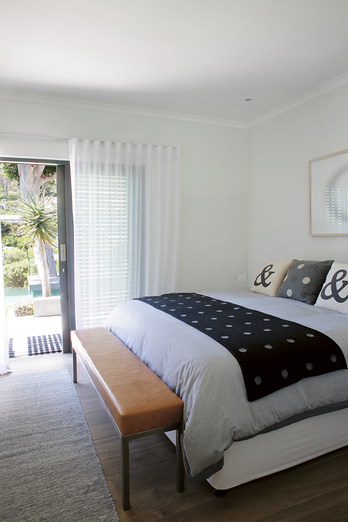  Sliding doors with shutters open the guest bedroom to the garden. The bed linen is from Woolworths and the cushions are from NAP Living.