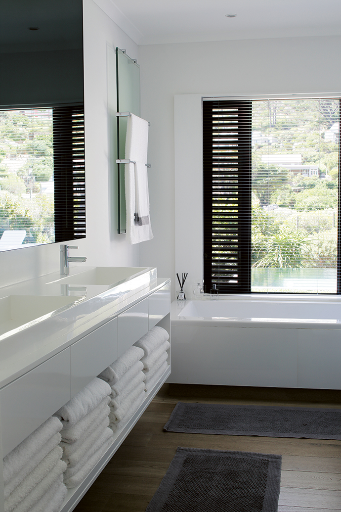 The bathrooms were modernised with contemporary fittings and concealed lighting, all on dimmers. The windows were enlarged to frame the garden and were fitted with shutters – the key unifying element of the design.