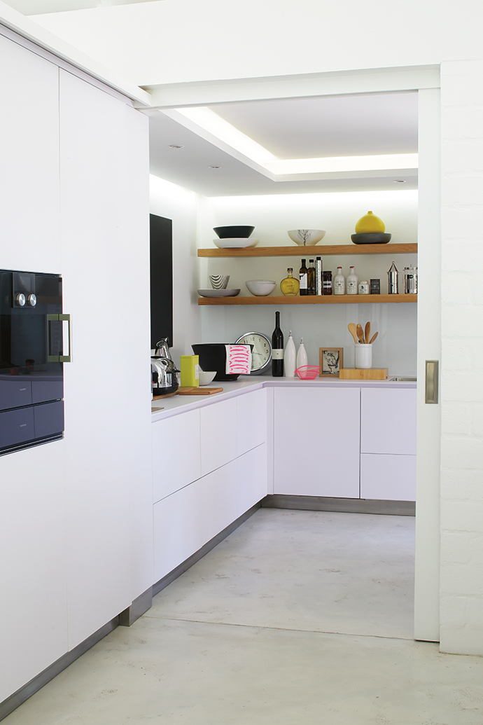 The client wanted a minimal kitchen with state-of-the-art appliances. The countertop is made of scratch-resistant Compaq laminate from Italy, and the German brand Gaggenau was chosen for appliances.