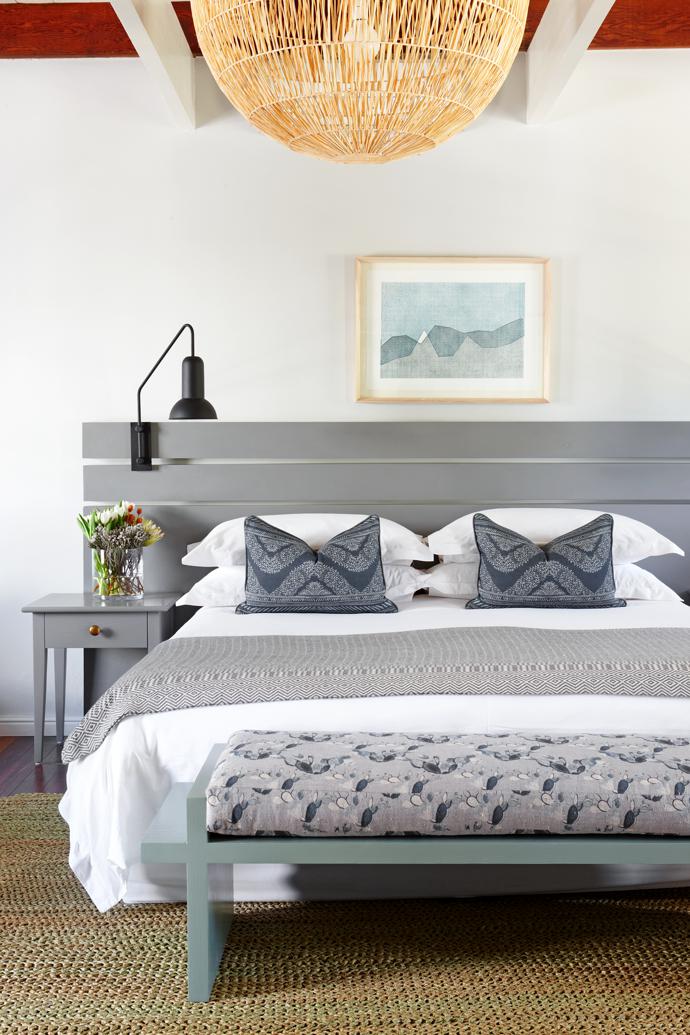 Bespoke fabrics by Alexis Barrell were used to make the cushions, bedspread and bolster on the bench.