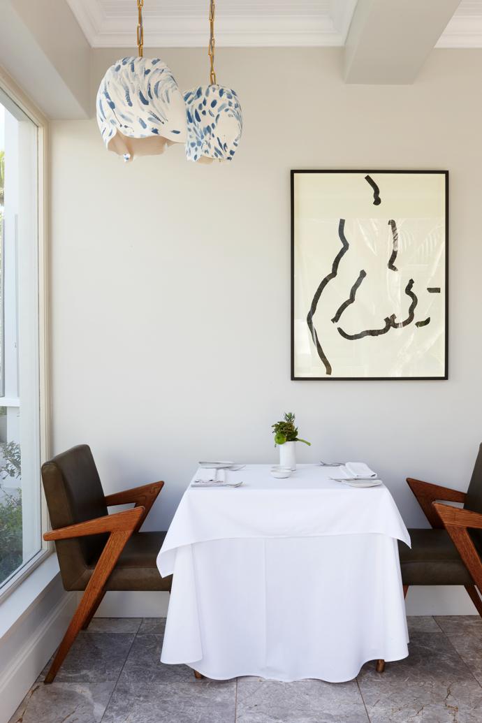 The hand-crafted pendant lights in the restaurant are by Lisa Firer and the artwork is 