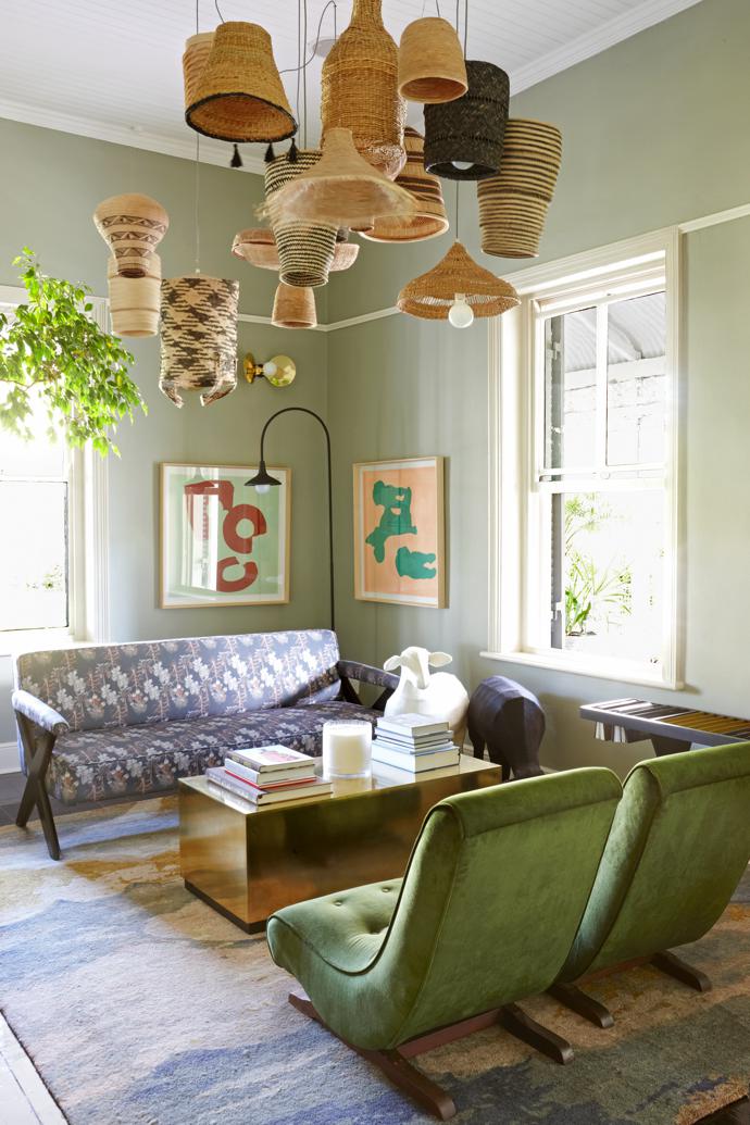 The pendant installation in the lounge, which was made using baskets from Binky Newman, is by Design Afrika. The sofa by Guideline is upholstered in Alexis Barrell fabric, created especially for the hotel. On the walls are artworks by Claire Johnson. The brass cube coffee table is by Studio No 19. The sheep sculptures are by Ronel Jordaan, the hand-made rug is from Gonsenhausers Fine Rugs and the floor lamp is by Dokter and Misses.