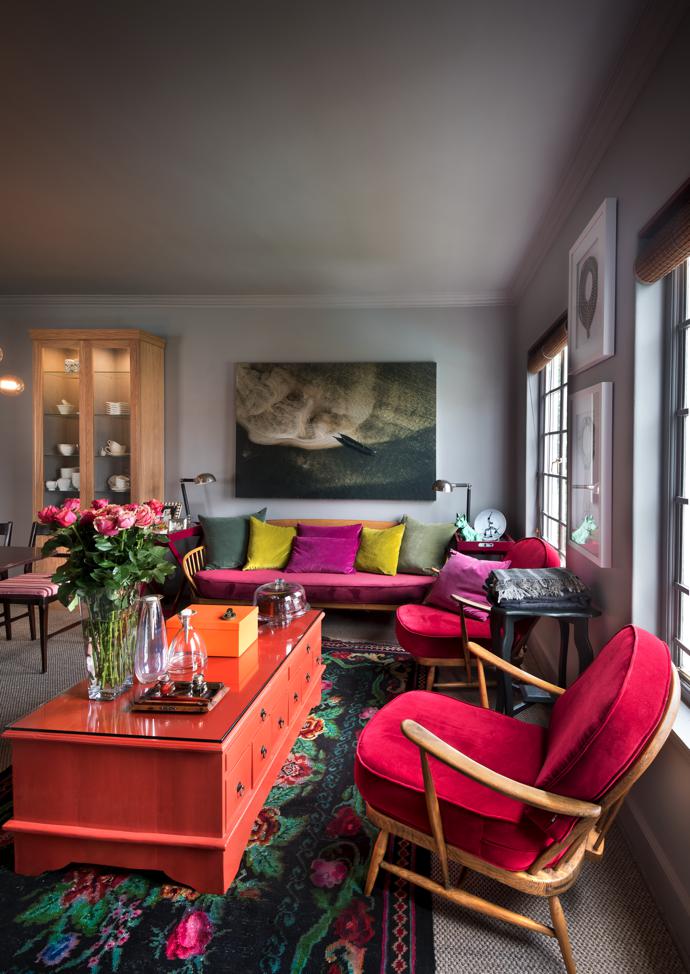 Lesley says she picked up the vintage Ercol sofa and chair for R125 rand when she was in her late 20s. Her father made her a set of tools and she scraped and sanded the wood down to the original oak. The colours introduced in velvets by Astrid match the needlepoint rug.