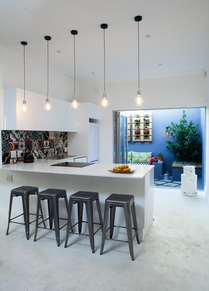 The pendant lights that illuminate their early morning croissant preparations are from Weylandts. The stools are from Chair Crazy.