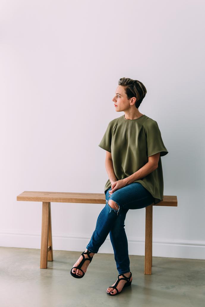 Nelia Malherbe, sitting on her favourite piece in the collection, the yellowwood bench Skoonheid.