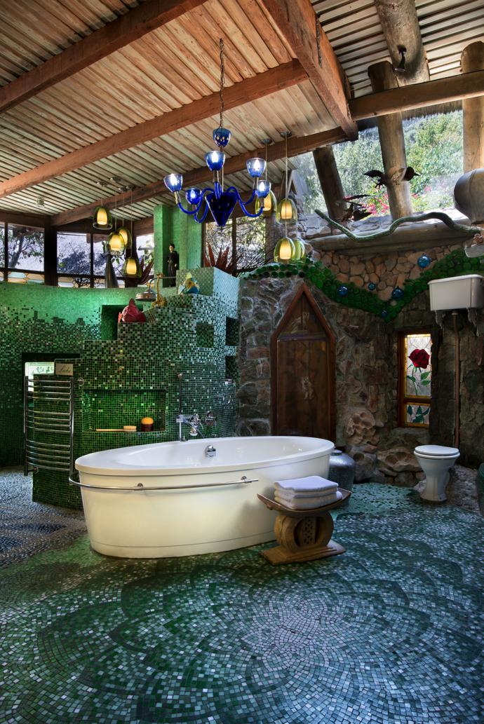 Mosaics in classic shades of green in one of the spacious, light filled bathrooms create the feel of a traditional hammam. The artworks are from Mark Valentine’s Amatuli, and the pendant lights were bought on travels to fairs in Italy and France.