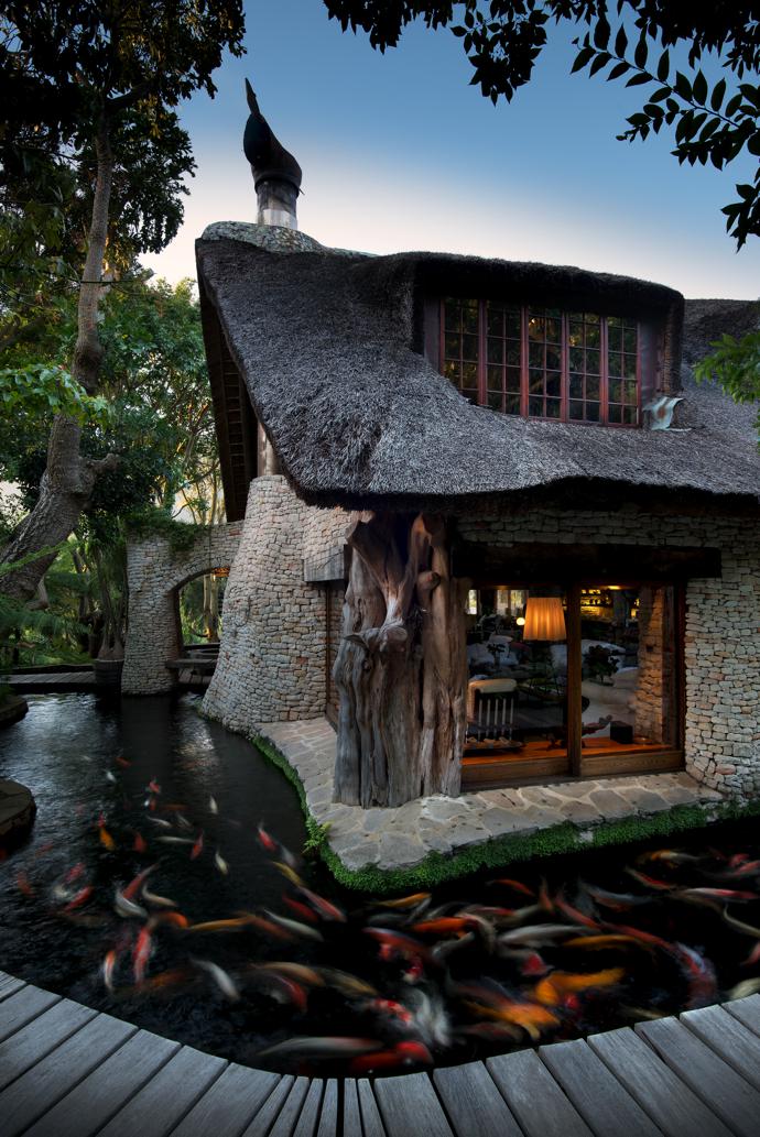 The main living area as seen from the outside, surrounded by a moat filled with multicoloured koi fish. In Asian cultures, koi are associated with good fortune and prosperity, and they symbolise growth and transformation (quite evident at Blackwood Lodge).