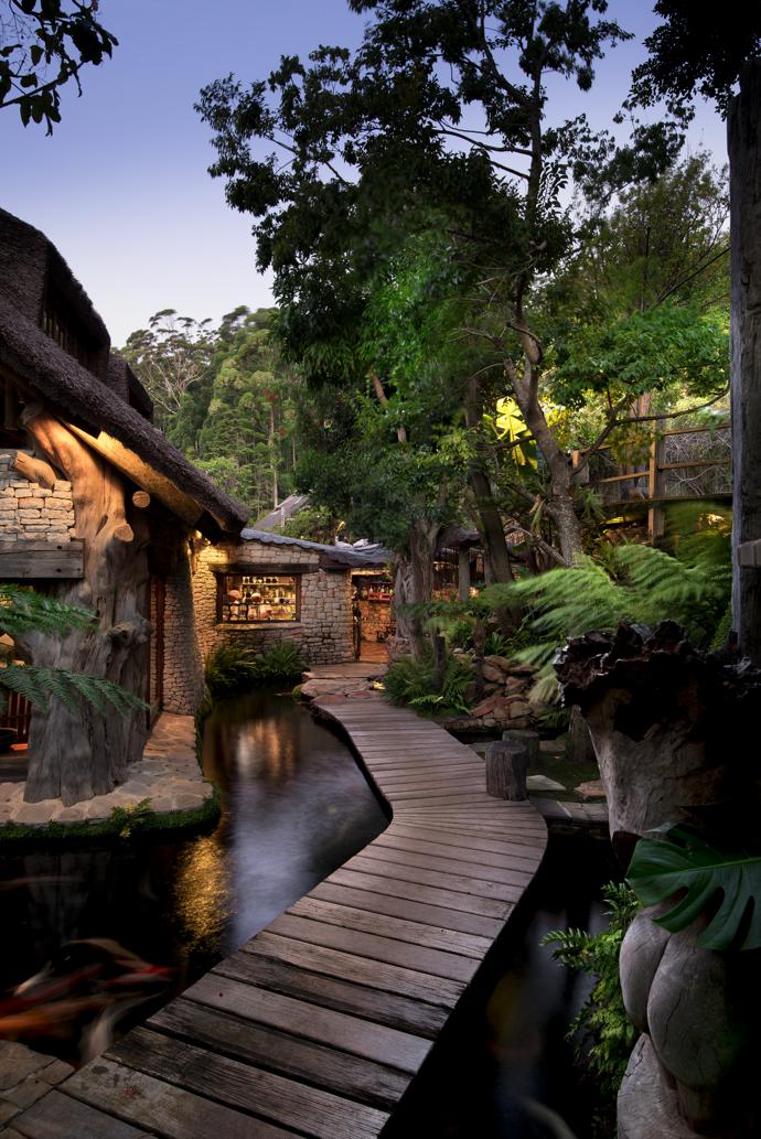 Wooden walkways lead across the moat and around the house to the kitchen door. None of the doors have keys; each one is fitted with a keypad programmed for a security code. Apart from the convenience, this allows for tracking the comings and goings in the house.
