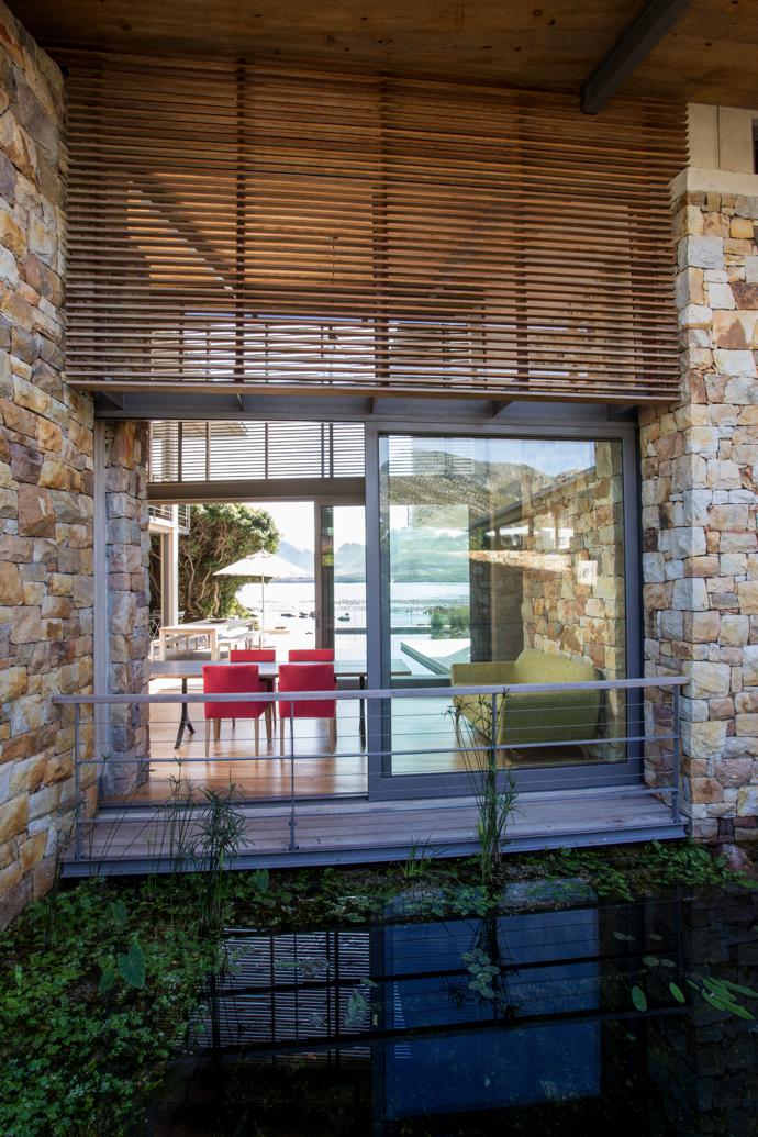 Every window in the house frames a picture-perfect scene. Slatted timber screening, shutters and decks are by Herbert Robinson; and the structural steelwork, handrailing and stairs are by Schrade Concepts. The sofa and chairs are from Scotch & Sofa.