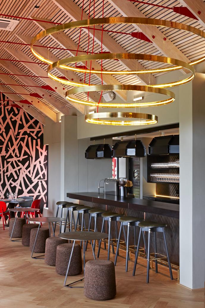 Wiid Design cork stools and Haldane Martin Sim-ply barstools create a casual drinking area at the bar.