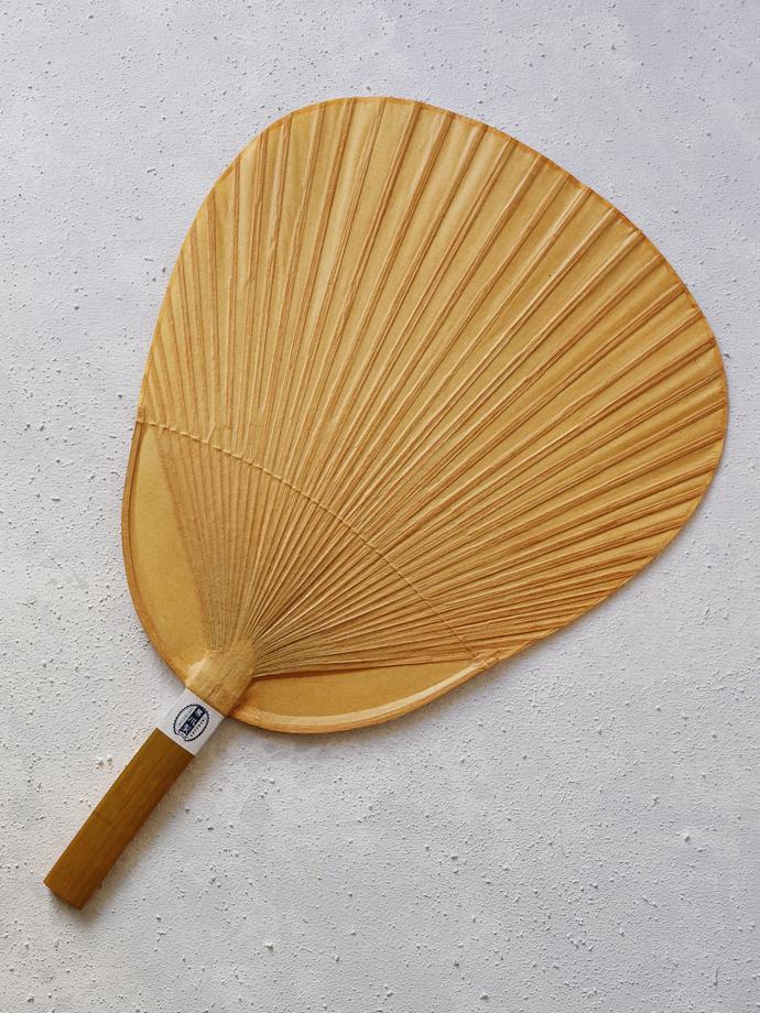 Shibu Uchiwa fan by Kutami, R600. Kutami is a town in Kumamoto Prefecture famous for its Japanese fans. The fan is made from paper and coated with persimmon tanning for durability and to repel insects. It is used to fan coals or cool rice.