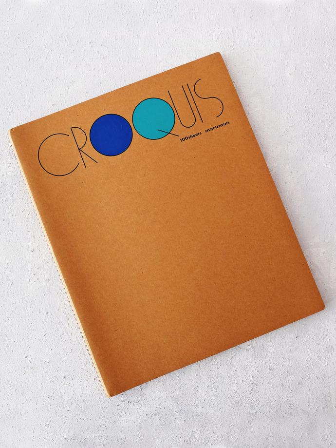 Croquis Sketchbook (Medium) by Maruman, R230. Medium Croquis range sketchbook by Maruman, a paper company established in 1920. The book includes 100 sheets of 52.3g/㎡ Maruman original white croquis paper with a cover made of durable kraft paper and wire spiral binding.