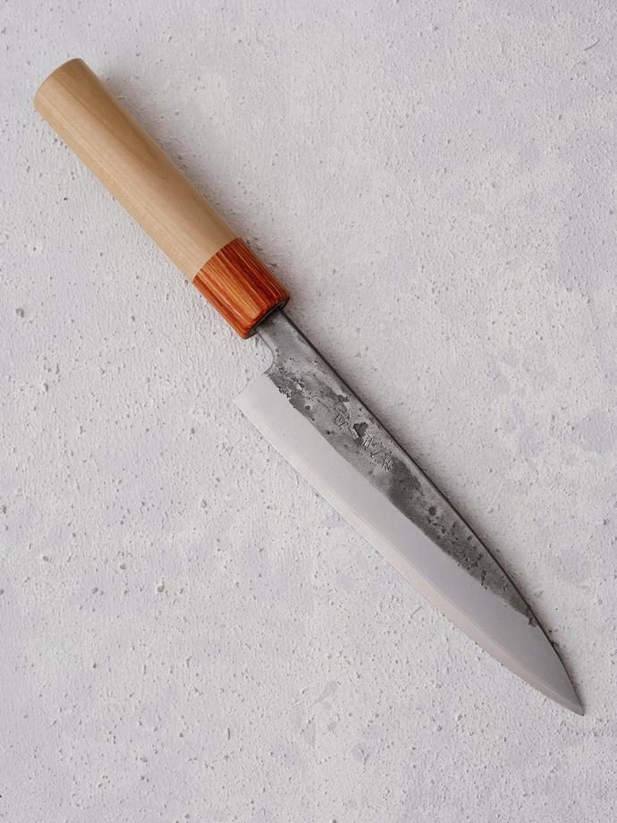 Hiraki Knife (165 mm) by Tadafusa, R2 100. The hiraki is a filleting knife often used for fish, but can also be used as a slightly smaller chef's knife. The handle is magnolia wood and the blade is stainless laminated blue paper steel with a 