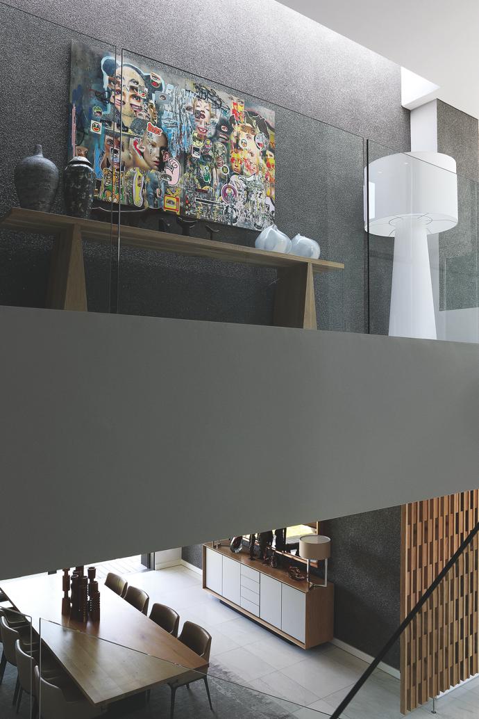 A Big Shadow standing lamp by Marcel Wanders for Cappellini and a collage artwork by Asha Zero fill the landing. 