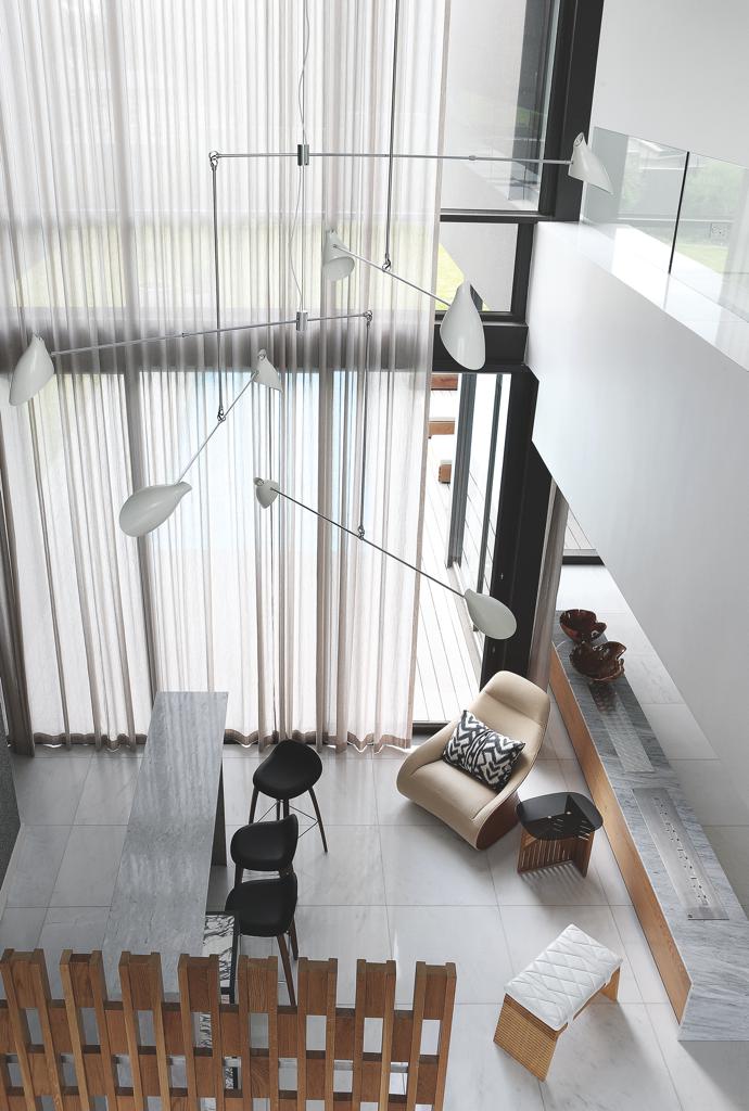 A David Weeks mobile chandelier hangs above the bar. 