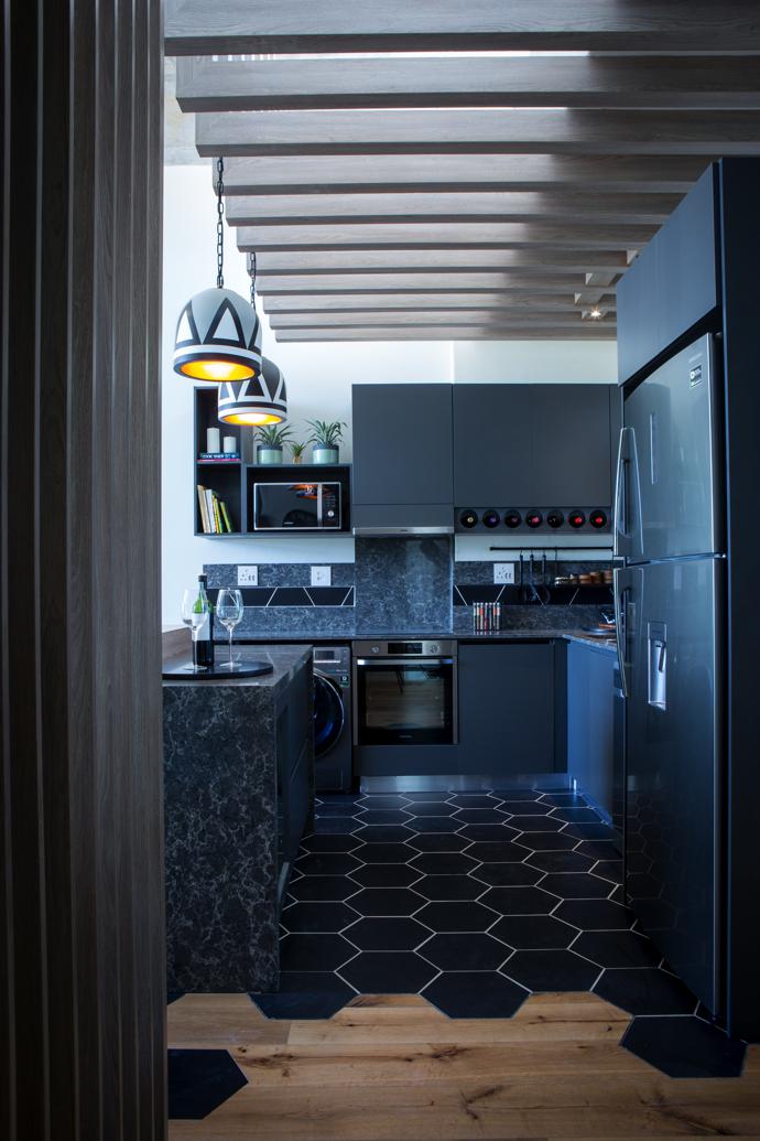 The winning kitchen featuring the Gold Bottom Pot pendant lights. 