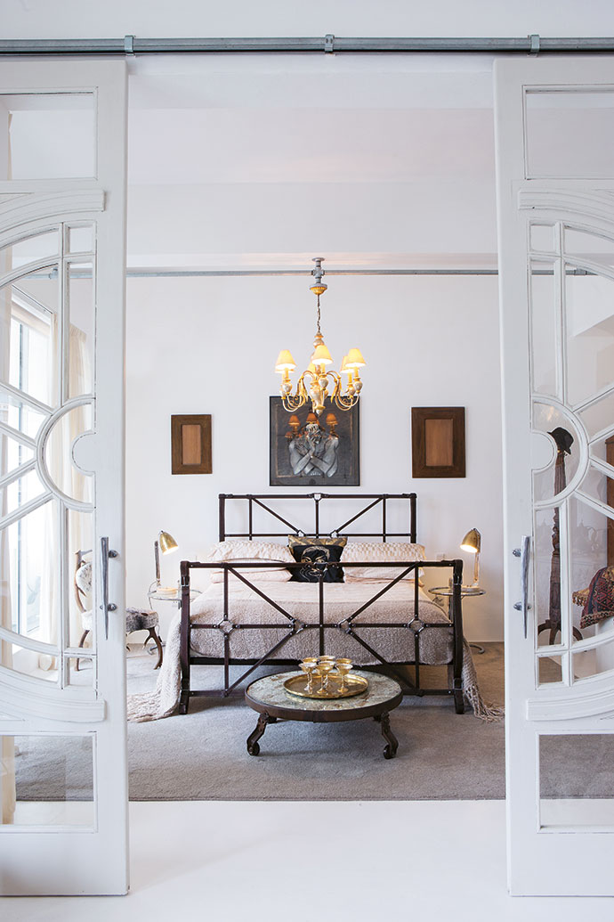 The “leather strappy
style” of the bed in the main bedroom appeals
to Cecile, who thinks everything should be wearable fashion. The gold tray and wine goblets have sentimental
value – the Pauls
bought them in
Krugersdorp, where
they got married.