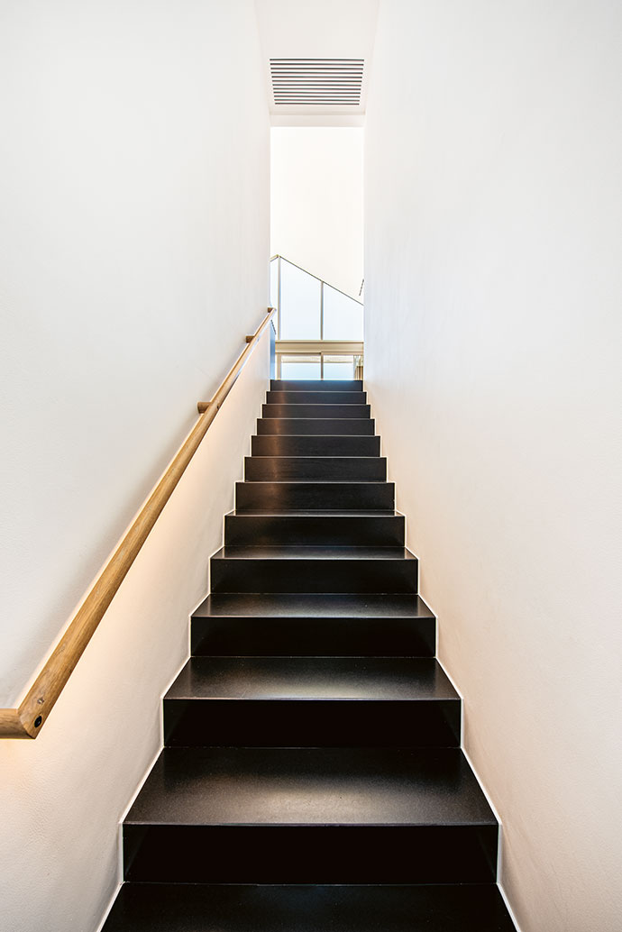 White walls are repeated throughout the home, creating an easy flow and sense of space.