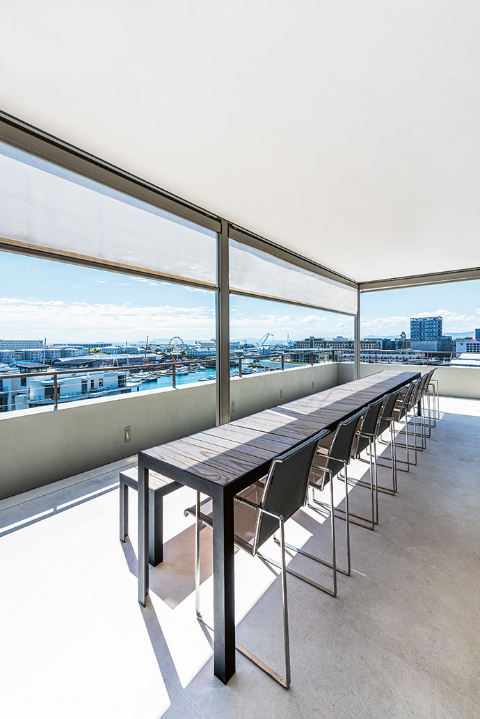 A dining set designed by Elzanne le Roux-Preis takes pride of place on the balcony.