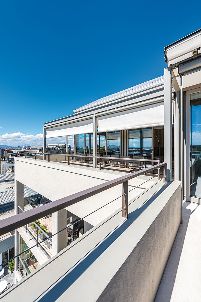 Panoramic views of the city and ocean can be taken in from the wraparound balcony.