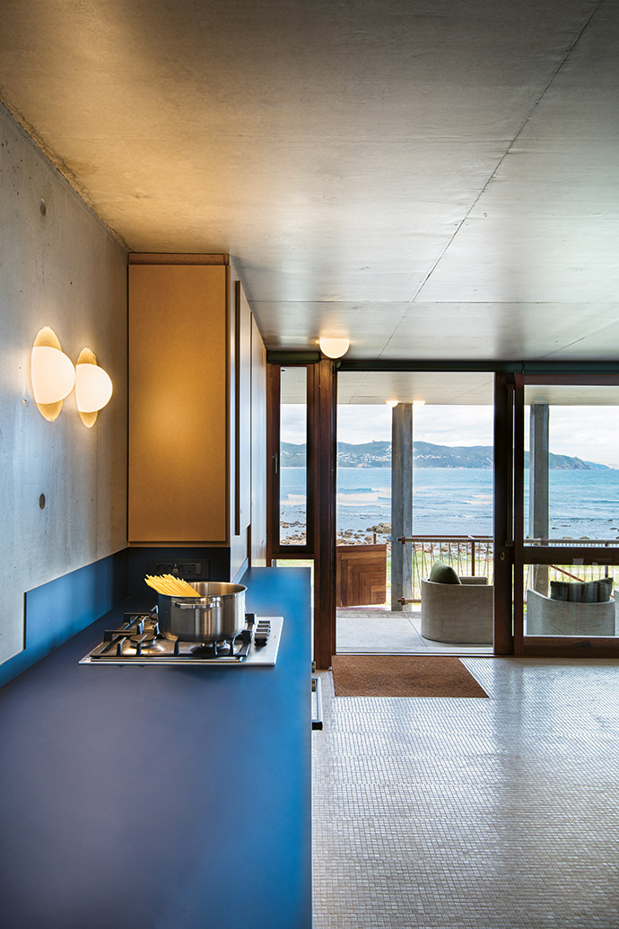 Basic ball lights recessed into the concrete are a functional yet stylish design feature throughout the house.