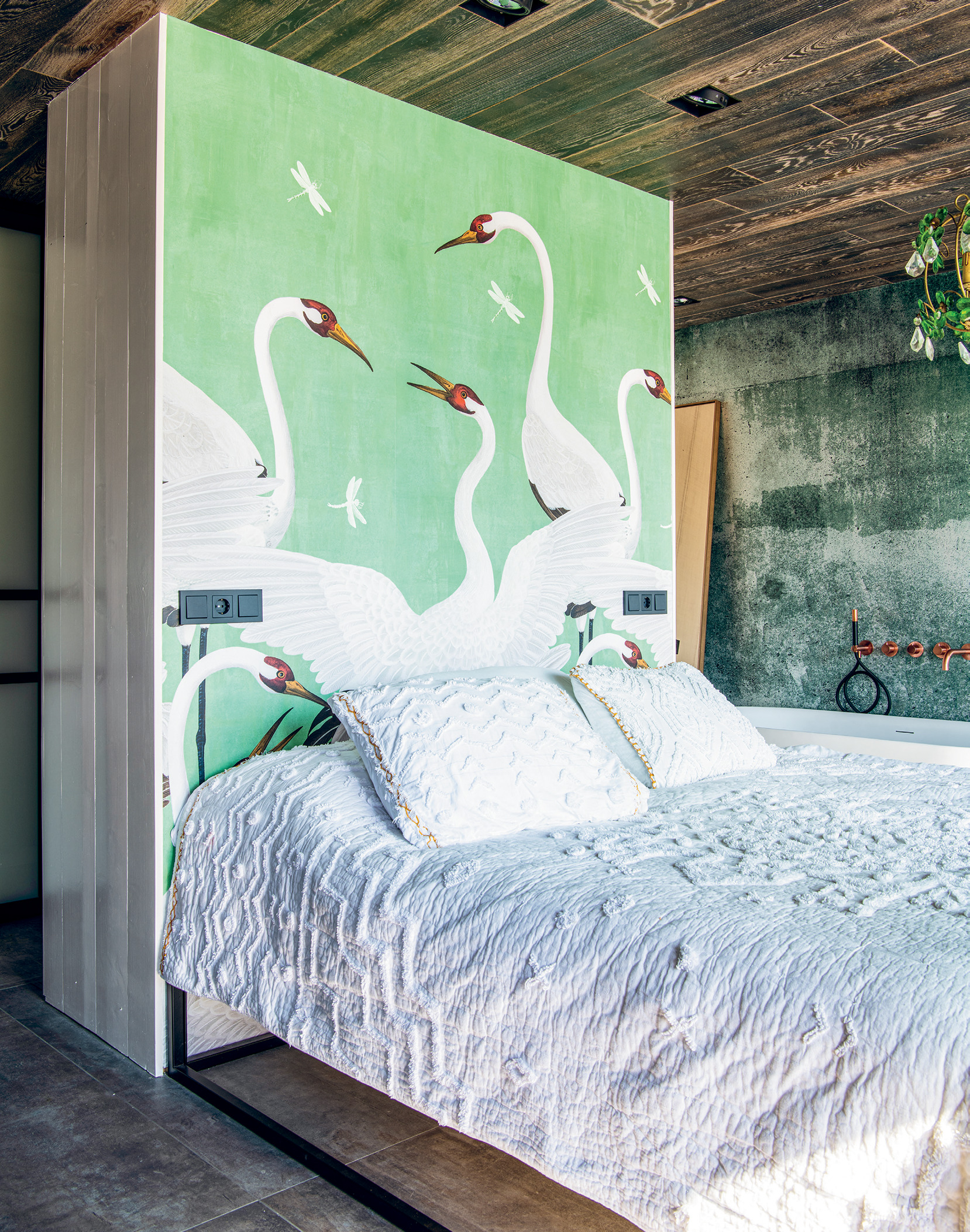 Gucci’s heron-print wallpaper plays a dual role in the master suite, as an undeniable focal point and a modern take on a headboard.
