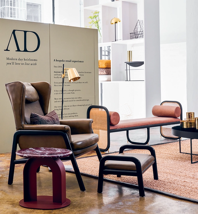 The Robert wingback chair and stool are complemented by a chunky side table.