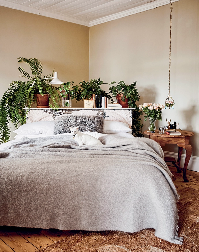 Wanting her bedroom to be completely different from the other rooms in the house, Sanet teamed up with Rupert to transform an old store counter into a one-of-a-kind headboard adorned with Victorian ceiling plates. To add flair, she decided to tuck her bed into the corner of the room.