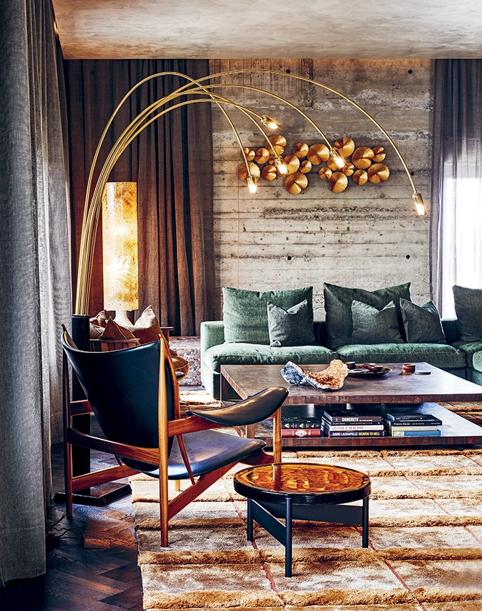 The two-storey Maastricht loft is a study in textures, with concrete, wood and metal living alongside softer fabrics, window treatments and luxurious rugs.