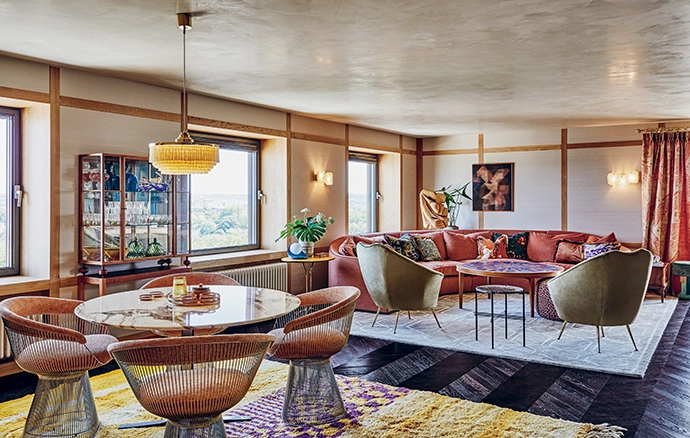 The large coffee table is a vintage find, while the wooden sculpture in the corner is part of Nicemakers’ private collection.