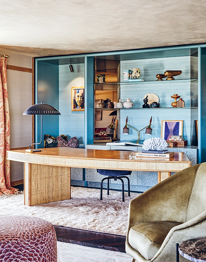 A home-office setup includes a custom wall unit, designed by Nicemakers and manufactured by Soons Interieurbouw, and a classic LC7 swivel chair by Charlotte Perriand for Cassina.