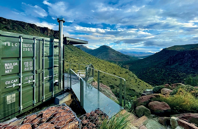 A steel walkway leads to the deck of the first unit.