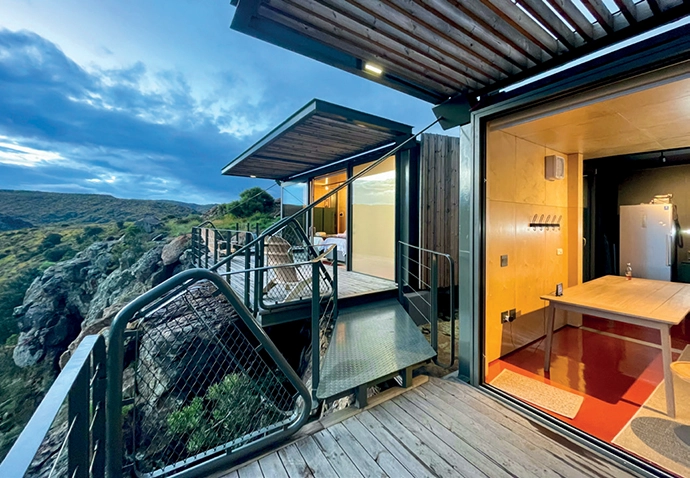 The decks and pergolas are connected by a small catwalk.